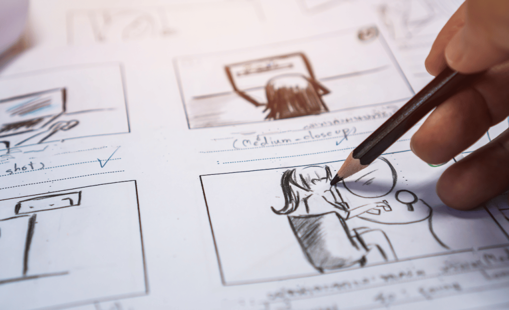 Person drawing a storyboard.