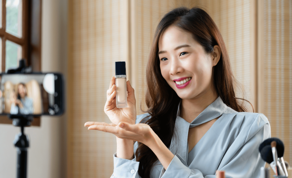 Woman creating a video of a beauty product she highly recommends